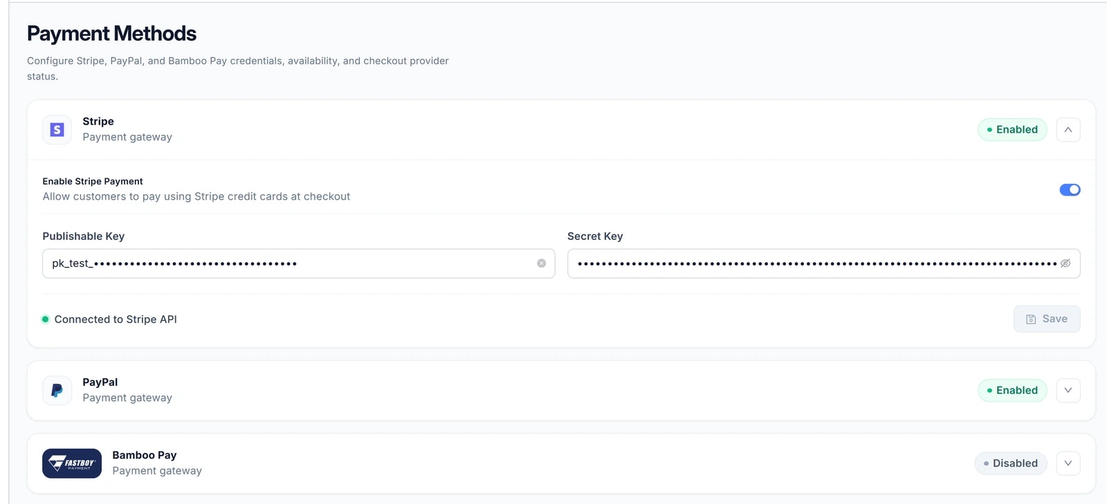 Thẻ Stripe đã mở: công tắc Enable Stripe Payment (bật), ô Publishable Key (giá trị đã che), ô Secret Key (dạng chấm ẩn), dòng Connected to Stripe API và nút Save. Bên dưới là thẻ PayPal và Bamboo Pay đang gập.